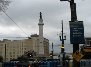 St. Charles Avenue undergoes a traffic circle at Lee Circle. Named after Confederate General Robert E. Lee, Lee Circle remains a popular destination to catch parades. Notice the row of port-o-lets at the bottom of the picture.